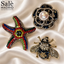 SET BROOCH 3PCS STAR FISH RAINBOW RED GREEN BLUE + BEE CRYSTAL NAVY CLEAR + CAMELLIA BLACK PEARL