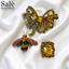 SET BUTTON CLIPS ANTIQUE BOW CHAMPAGNE + COLOURFUL BEE + RECTANGLE STONE